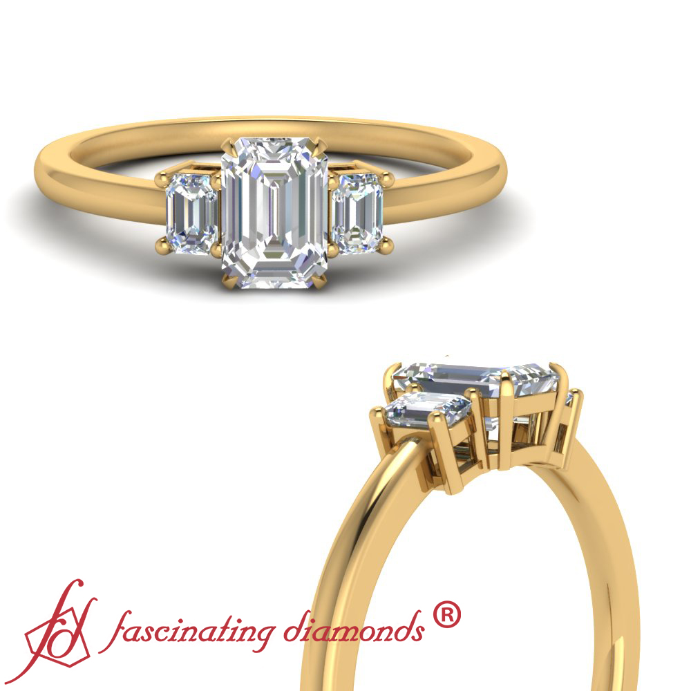 emerald cut three stone diamond ring yellow gold